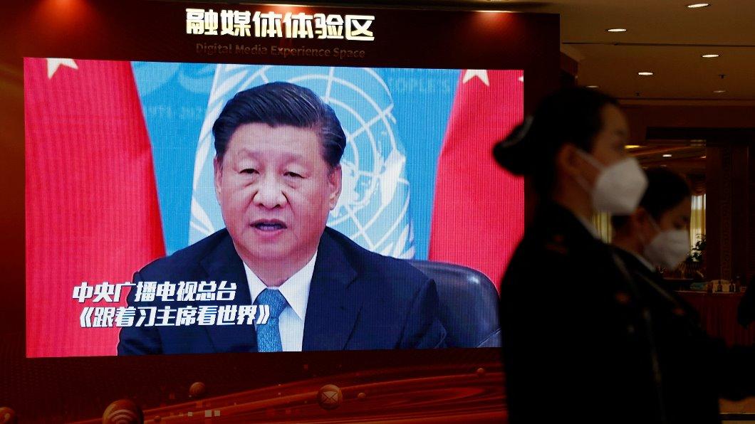 A screen displays an image of Chinese President Xi Jinping in a Beijing hotel. (Reuters)