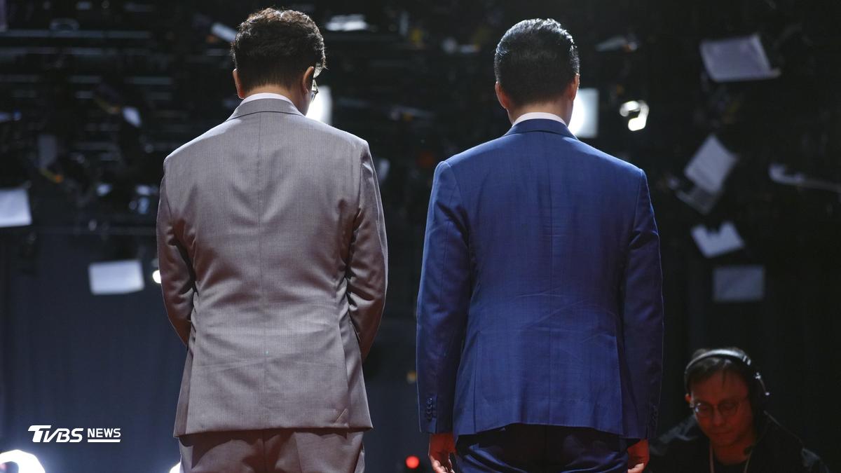 Legislator Puma Shen, left, and Mayor Chiang Wan-an stand on stage at Taipei's first mayoral debate Saturday, October 31, 2026. (TVBS News/Hwa Zi Chen)